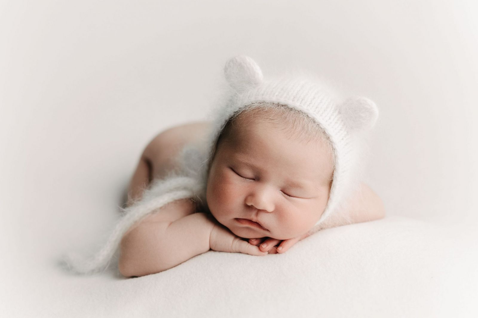 Newborn baby boy with bear bonnet